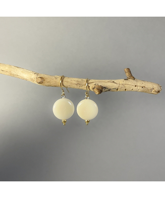 Boucles en ivoire végétal et or laminé, Kokobelli